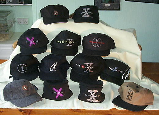 [All the hats in a row; Richard is hiding behind them]